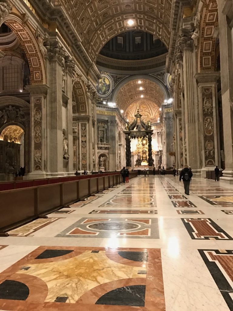 Image of the interior of St. Peter’s Basilica, featuring terrazzo floors